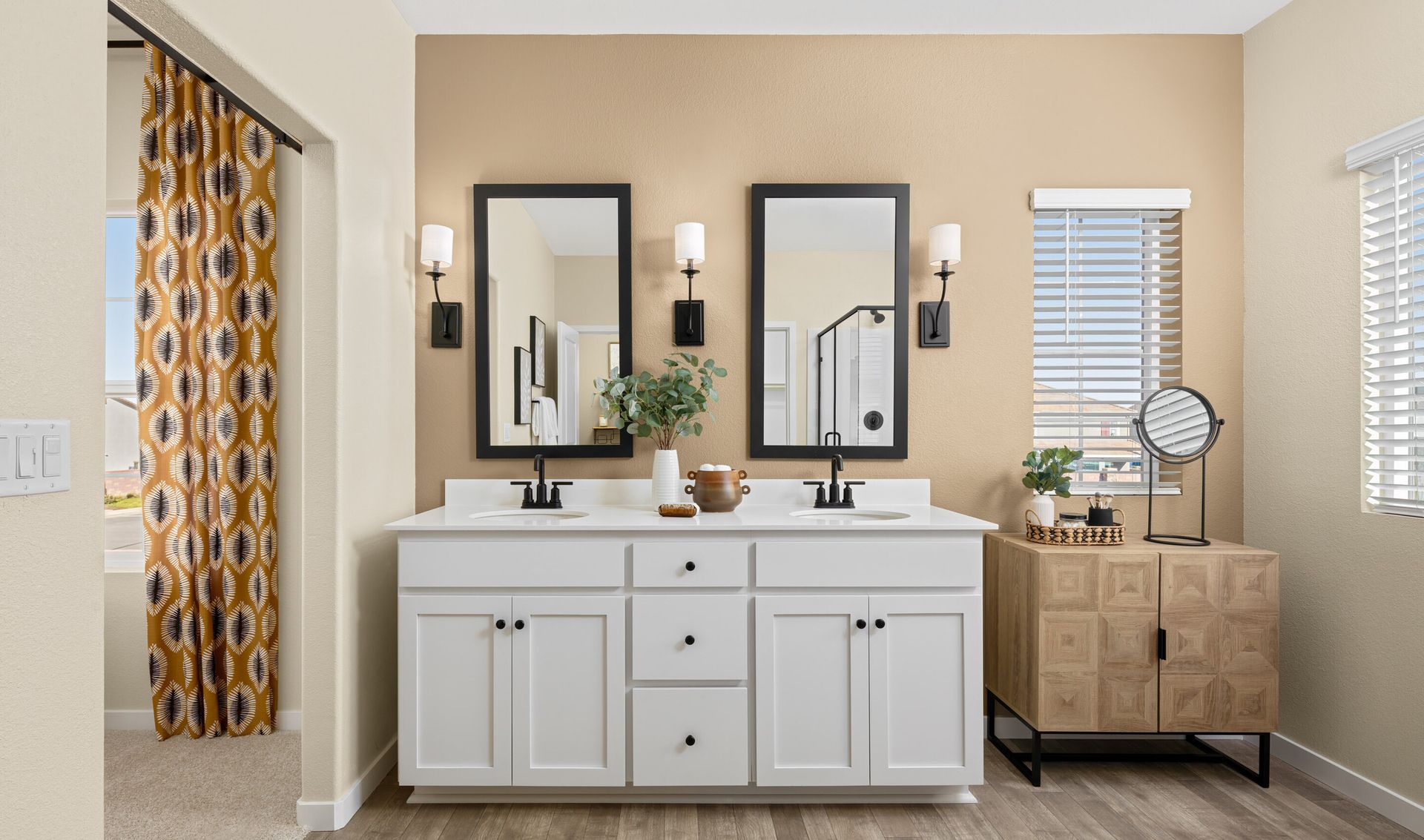 Primary bath with vanity and tile flooring