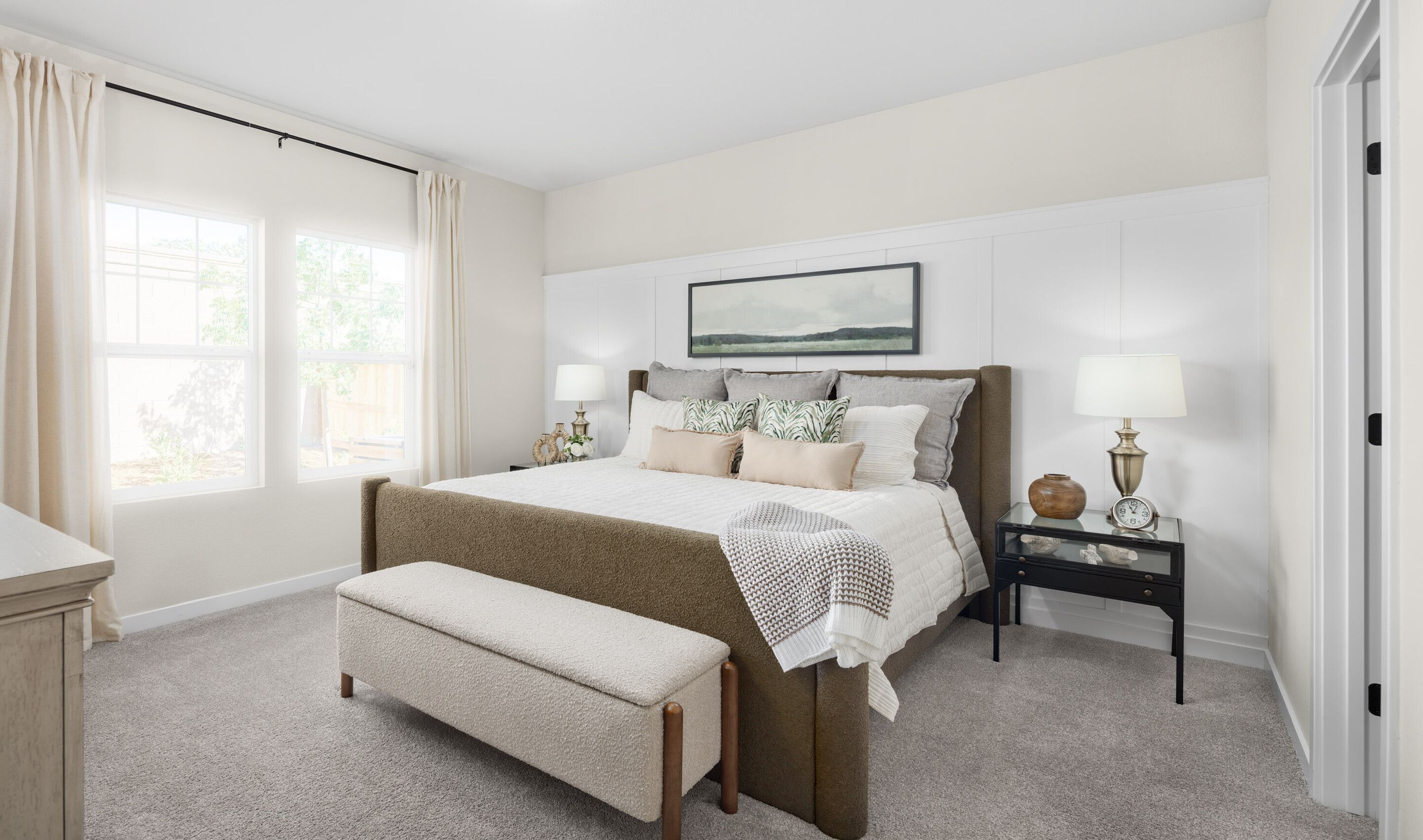 Primary suite with decorative feature wall