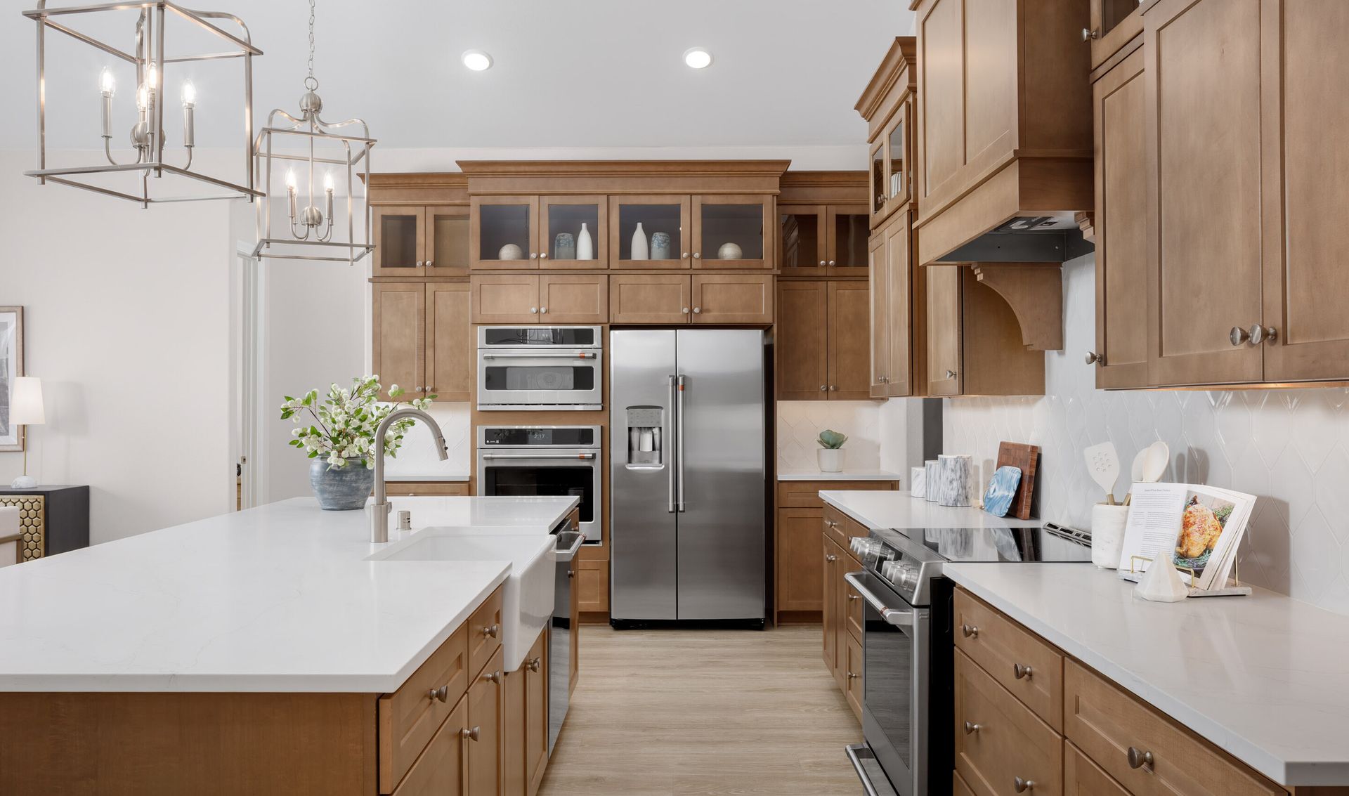 Stainless steel appliances and white apron-front sink