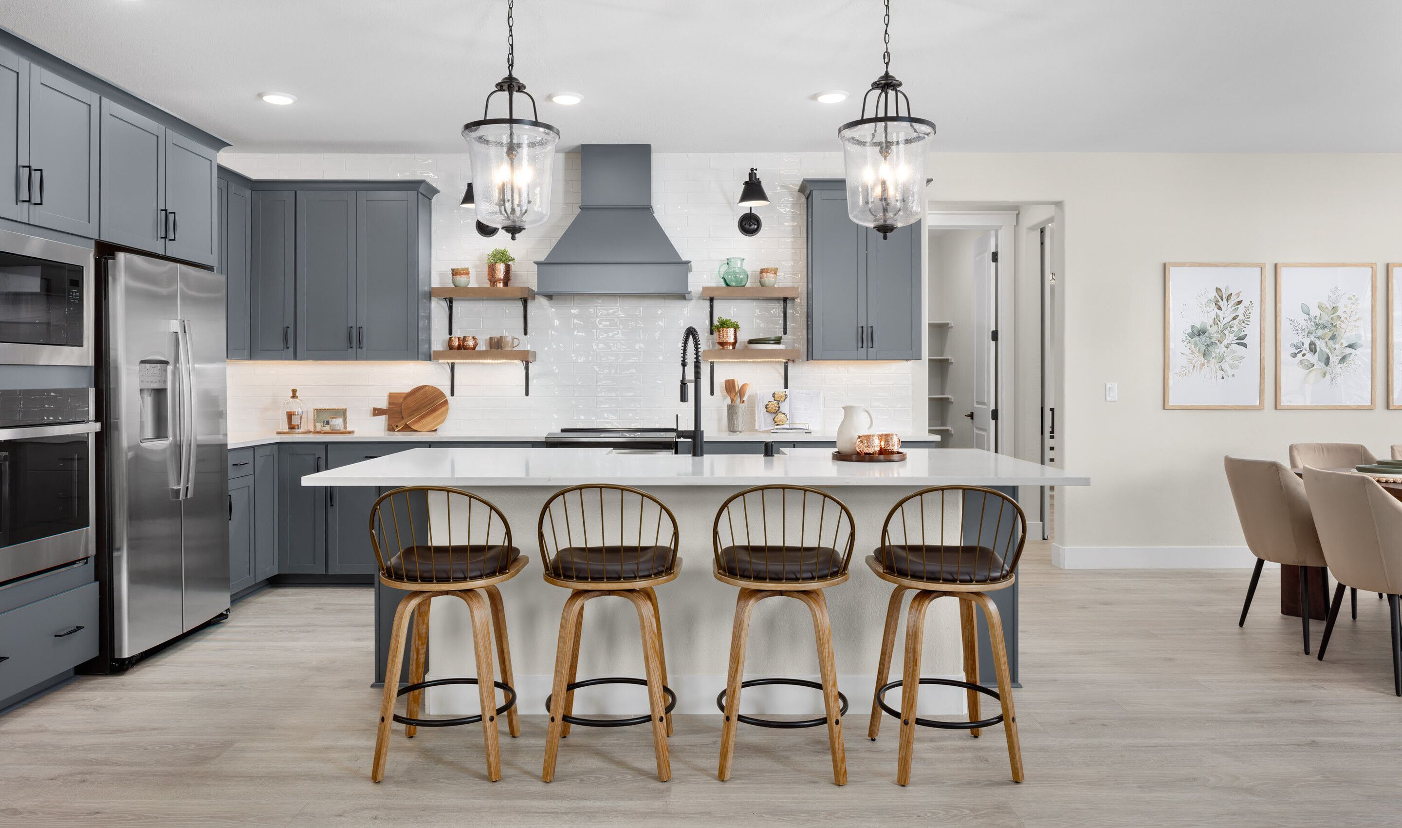 Kitchen with pendant lighting and stylish tile backsplash