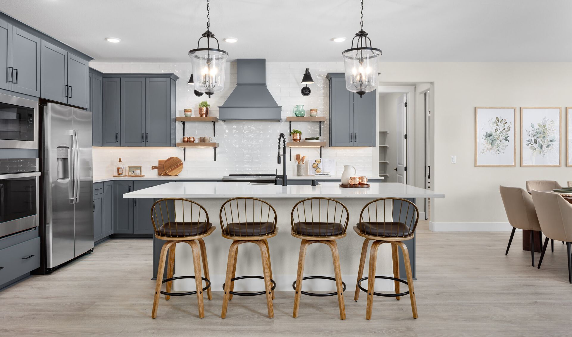 Kitchen with pendant lighting and stylish tile backsplash