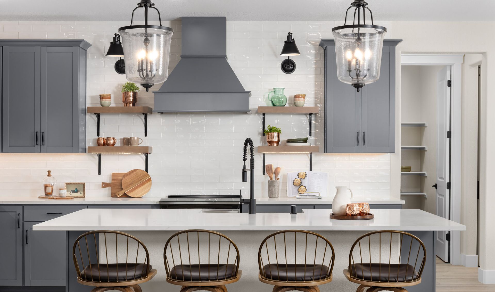 Full-height backsplash and floating shelves with undercabinet lighting