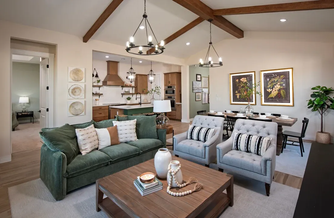 Great room with stained ceiling beams and chandeliers