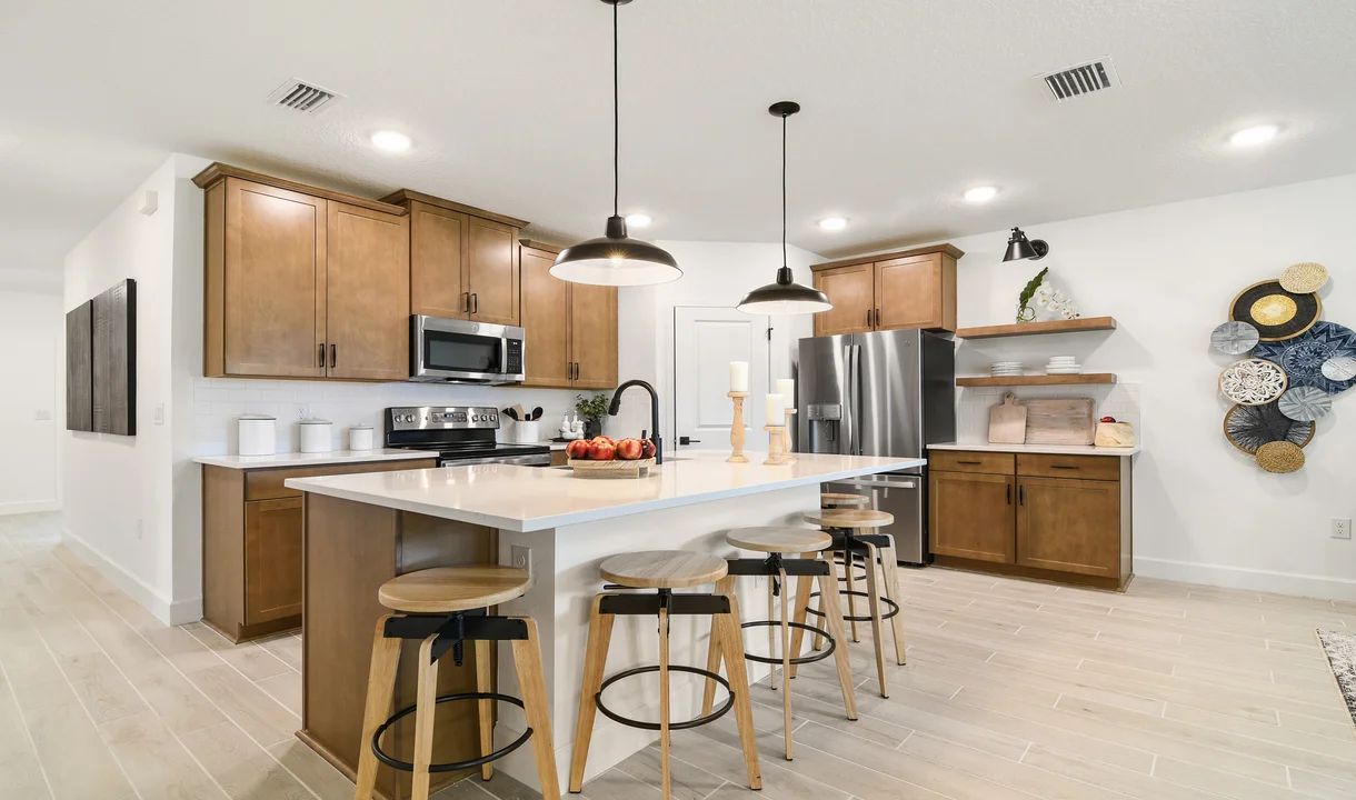 Kitchen with pendant lighting and floating shelves