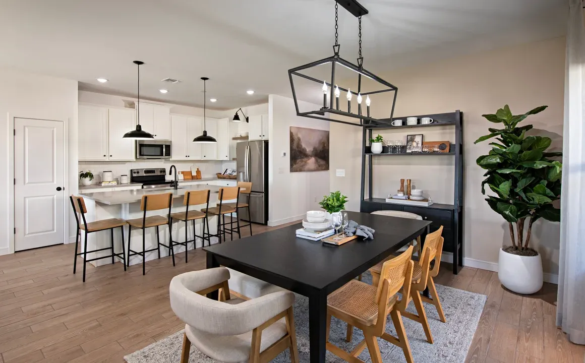 Dining area with chandelier overlooking kitchen