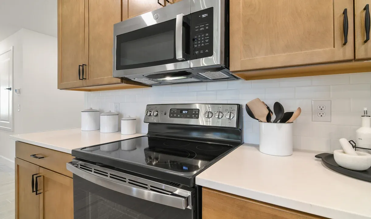 Kitchen with white tile backsplash