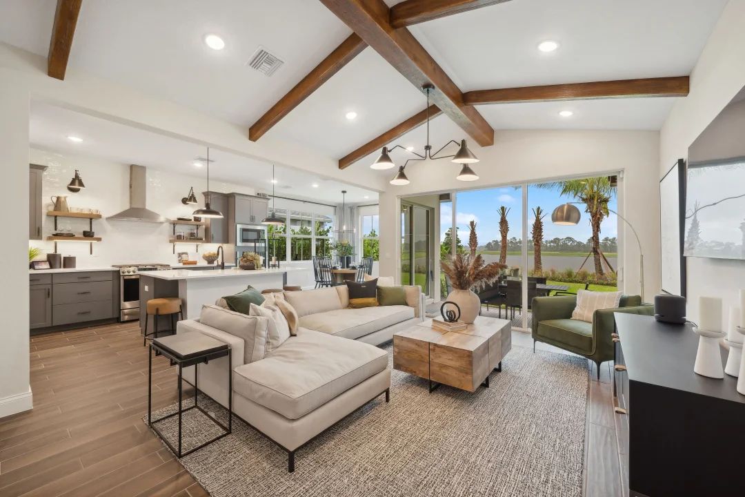 Great room with stained ceiling beams and vaulted ceiling