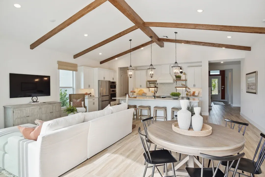 Dining area with vaulted ceiling and stained beams