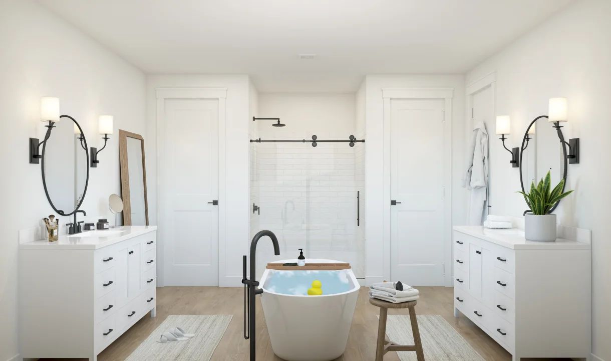 Primary bath with dual freestanding vanities
