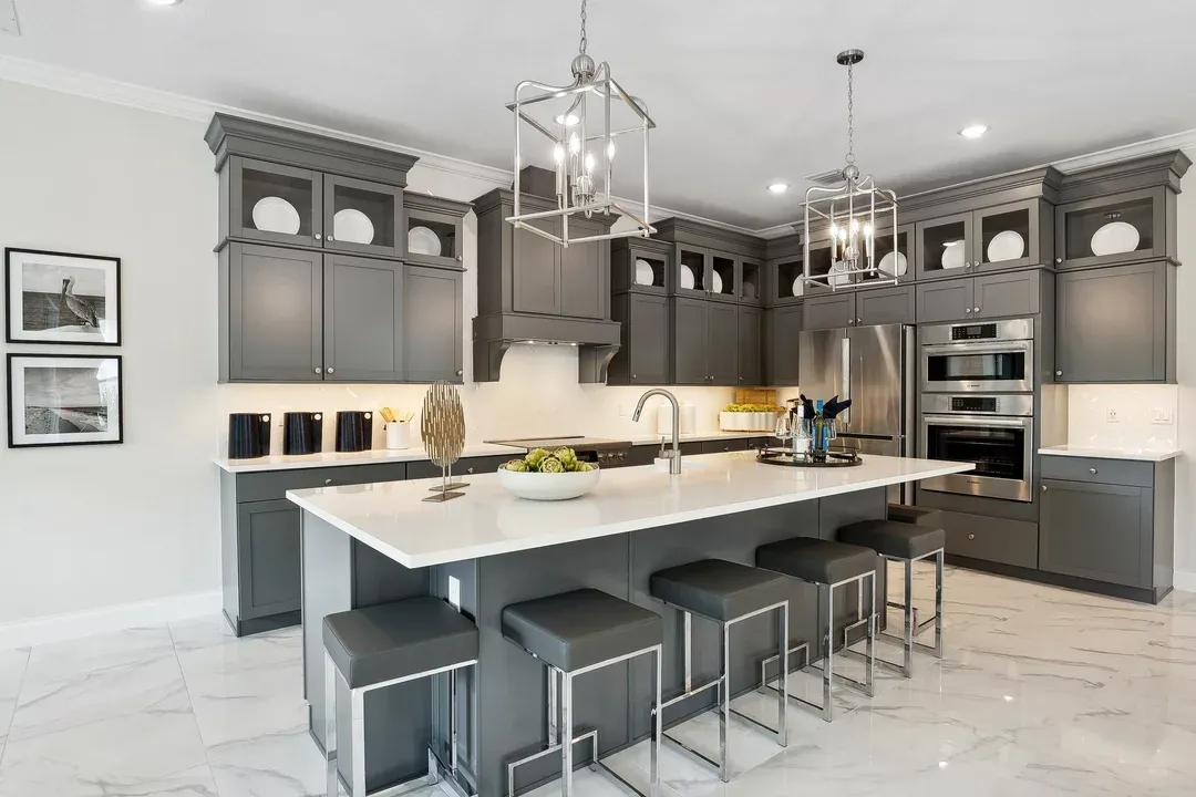 Kitchen with pendant lighting and glass upper cabinets
