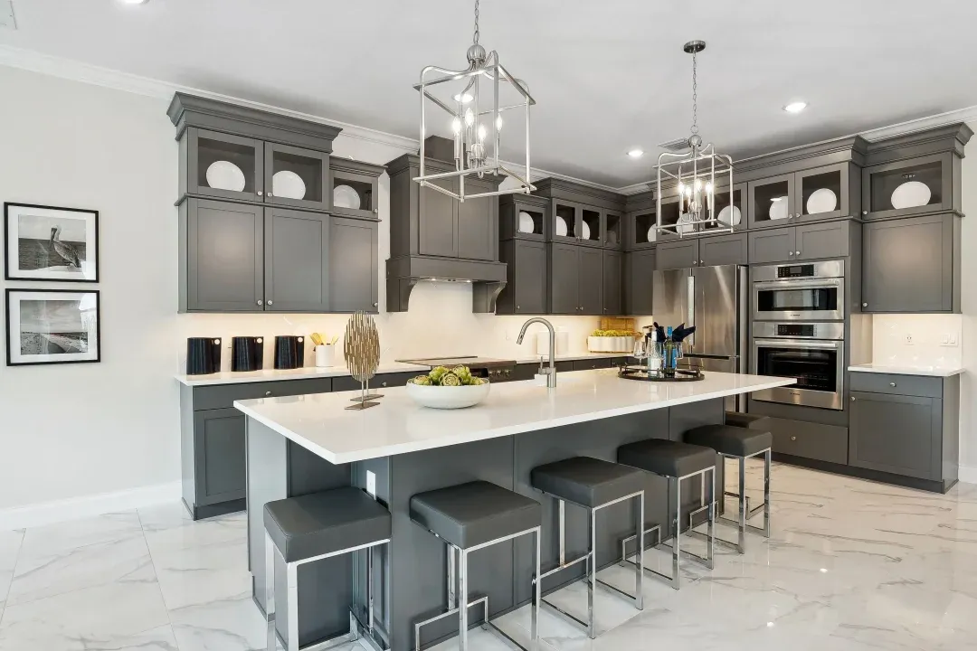 Kitchen with pendant lighting and glass upper cabinets
