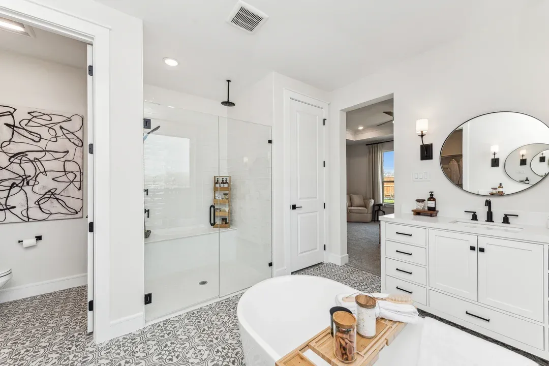 Private en suite primary bath with glass shower enclosure