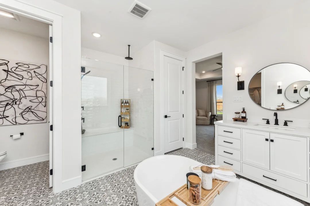 Private en suite primary bath with glass shower enclosure