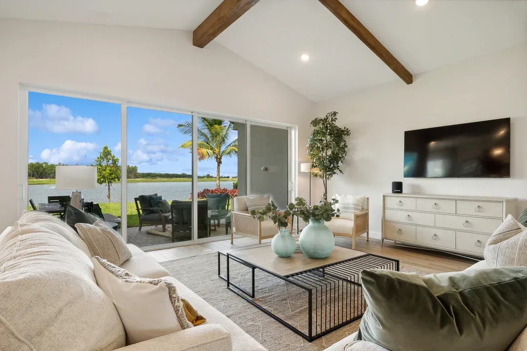 Great room with vaulted ceiling and ceiling beams