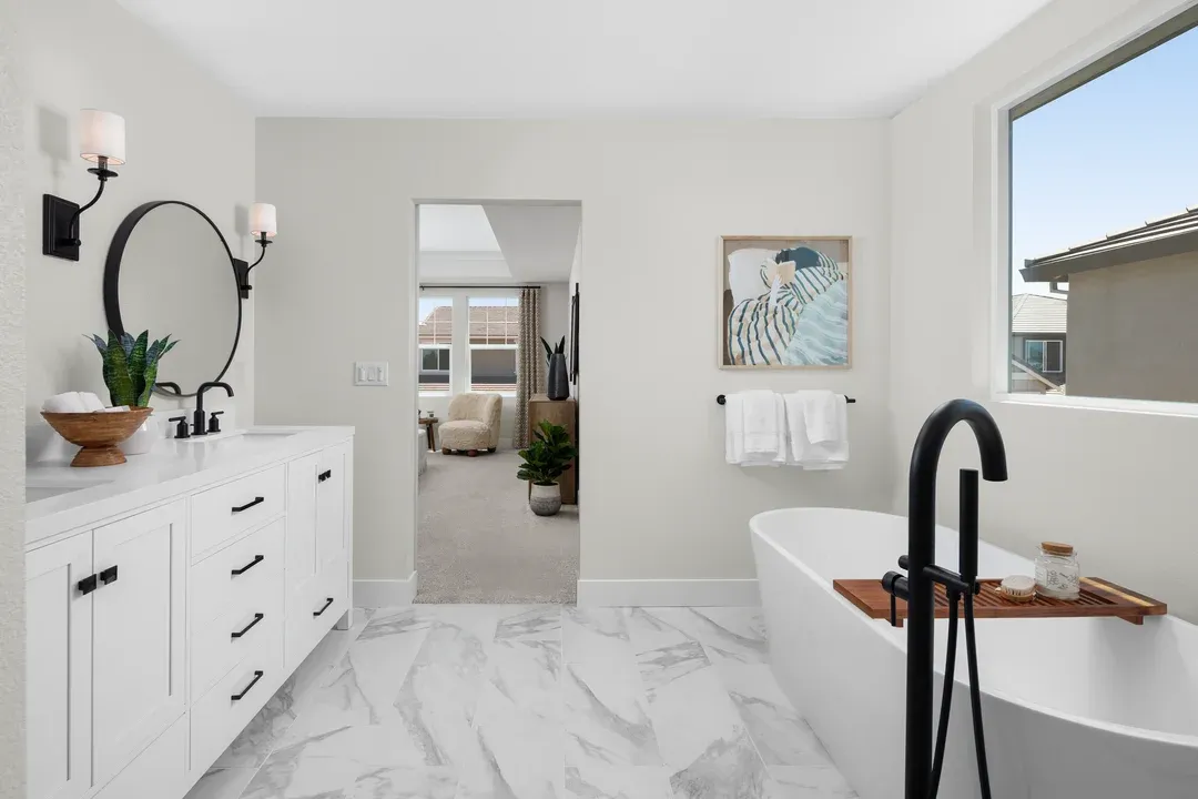 Primary bath with freestanding tub and freestanding vanity