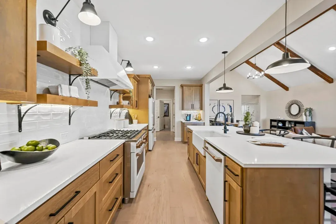 Kitchen with floating shelves and pendant lighting