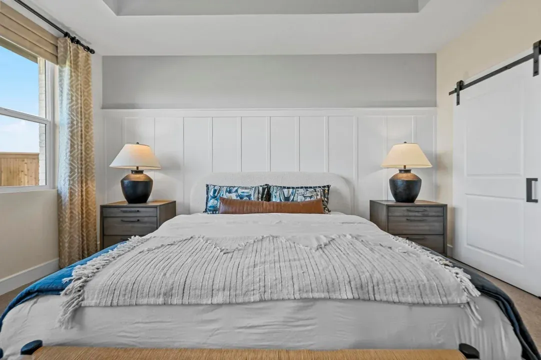 Primary suite with decorative feature wall