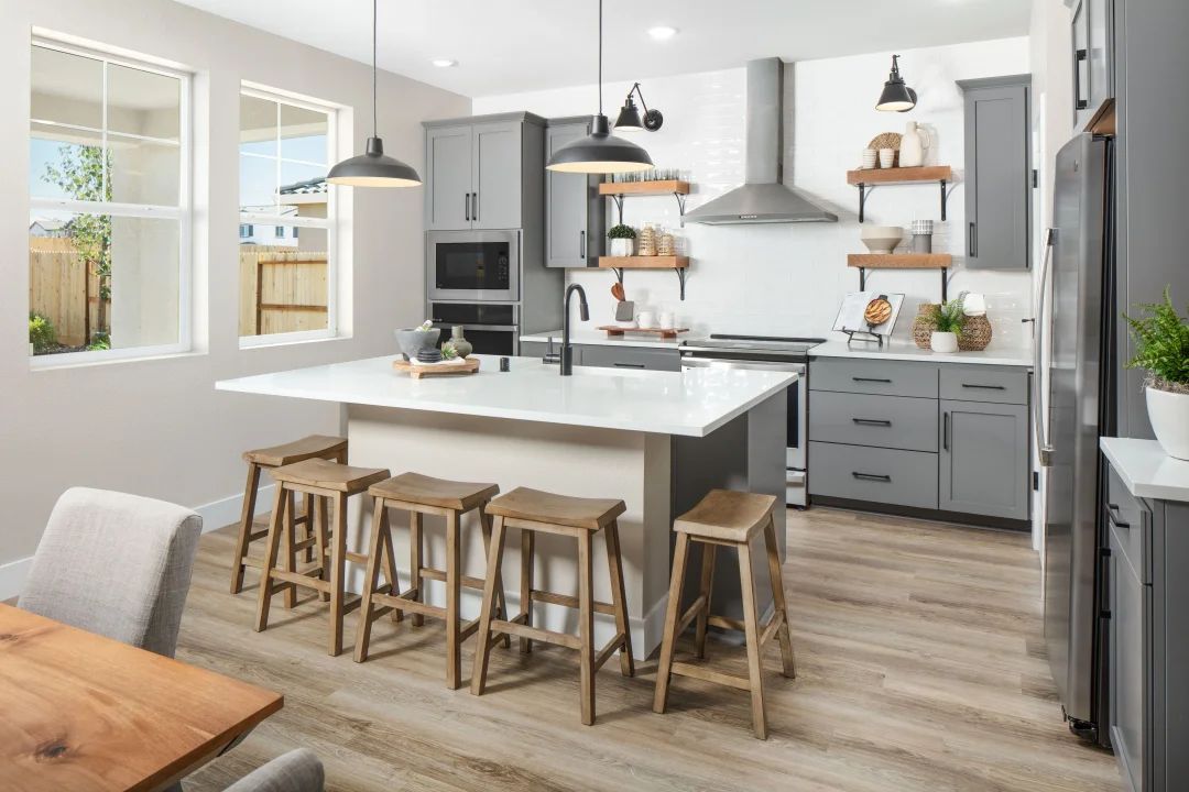 Kitchen with pendant lighting and floating shelves