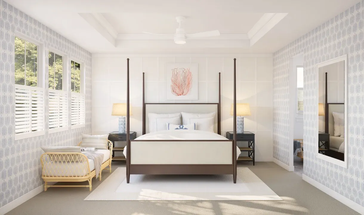 Primary suite with tray ceiling, crown moulding and decorative feature wall