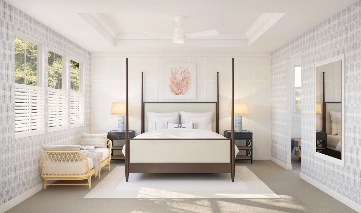 Primary suite with tray ceiling, crown moulding and decorative feature wall