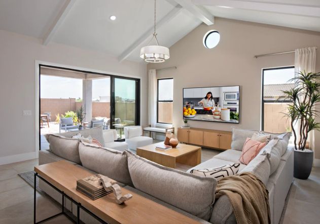 Great room with vaulted ceiling and white stained ceiling beams