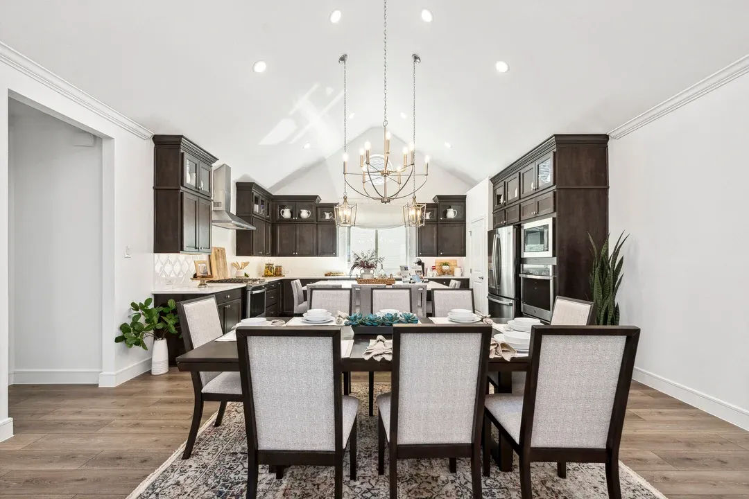 Dining area and kitchen with vaulted ceiling