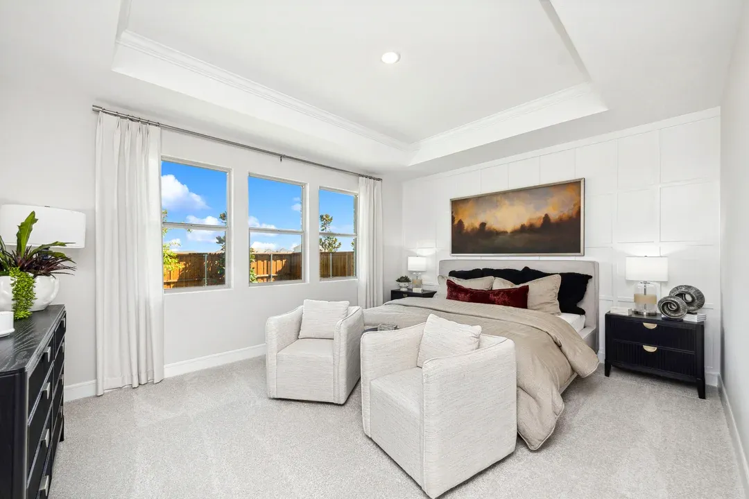 Primary suite with decorative feature wall