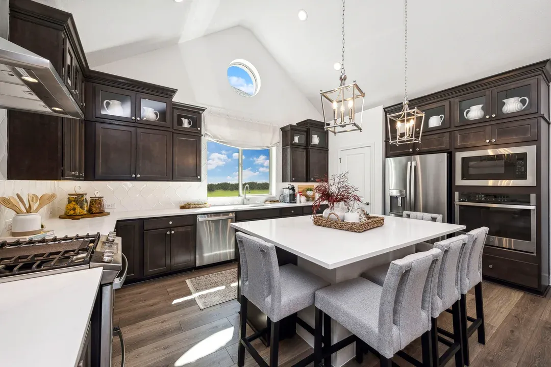 Vaulted ceiling with pendant lighting in kitchen