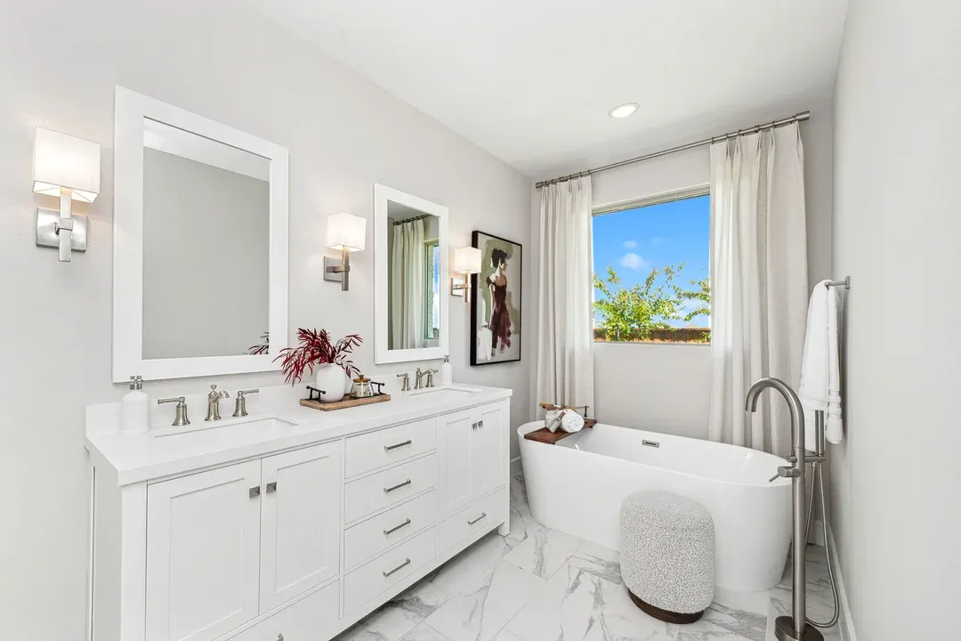 Primary bath with freestanding tub and glass shower enclosure