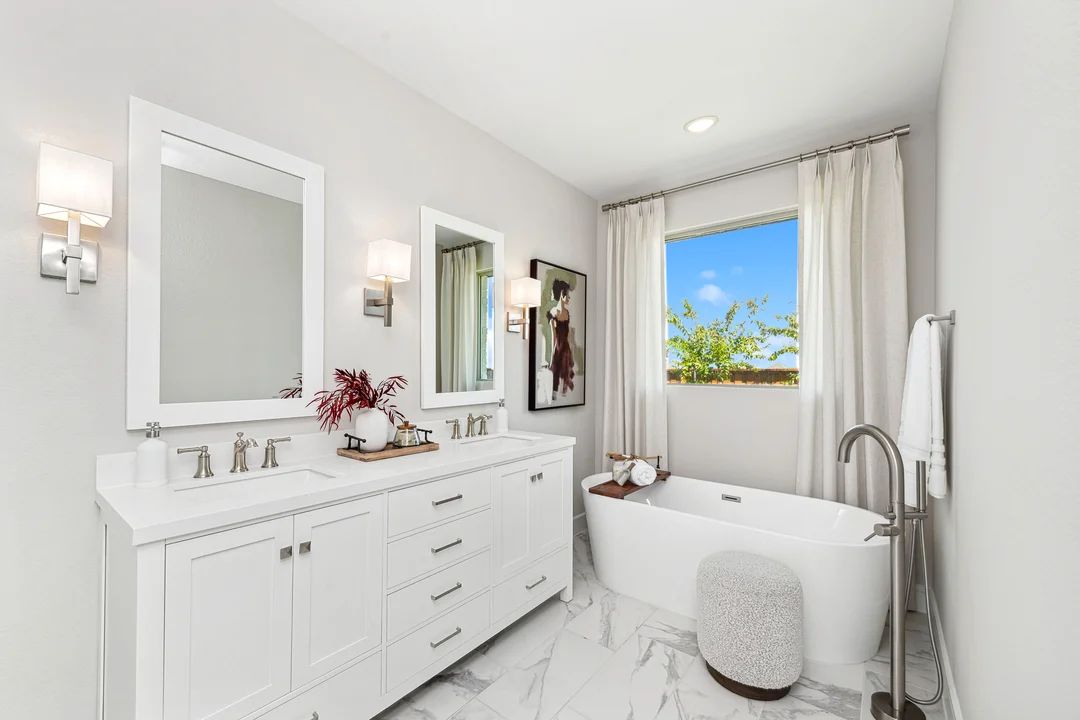 Primary bath with freestanding tub and glass shower enclosure