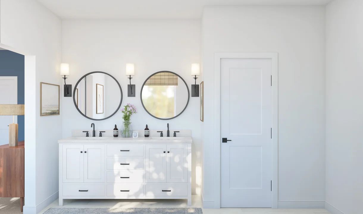 Primary bath features freestanding vanity with dual sinks
