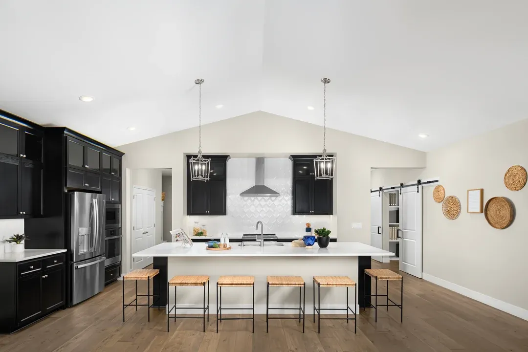 Kitchen with pendant lighting and vaulted ceiling