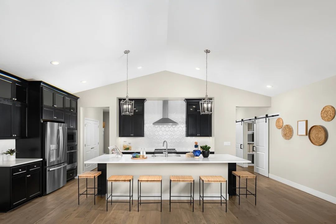 Kitchen with pendant lighting and vaulted ceiling