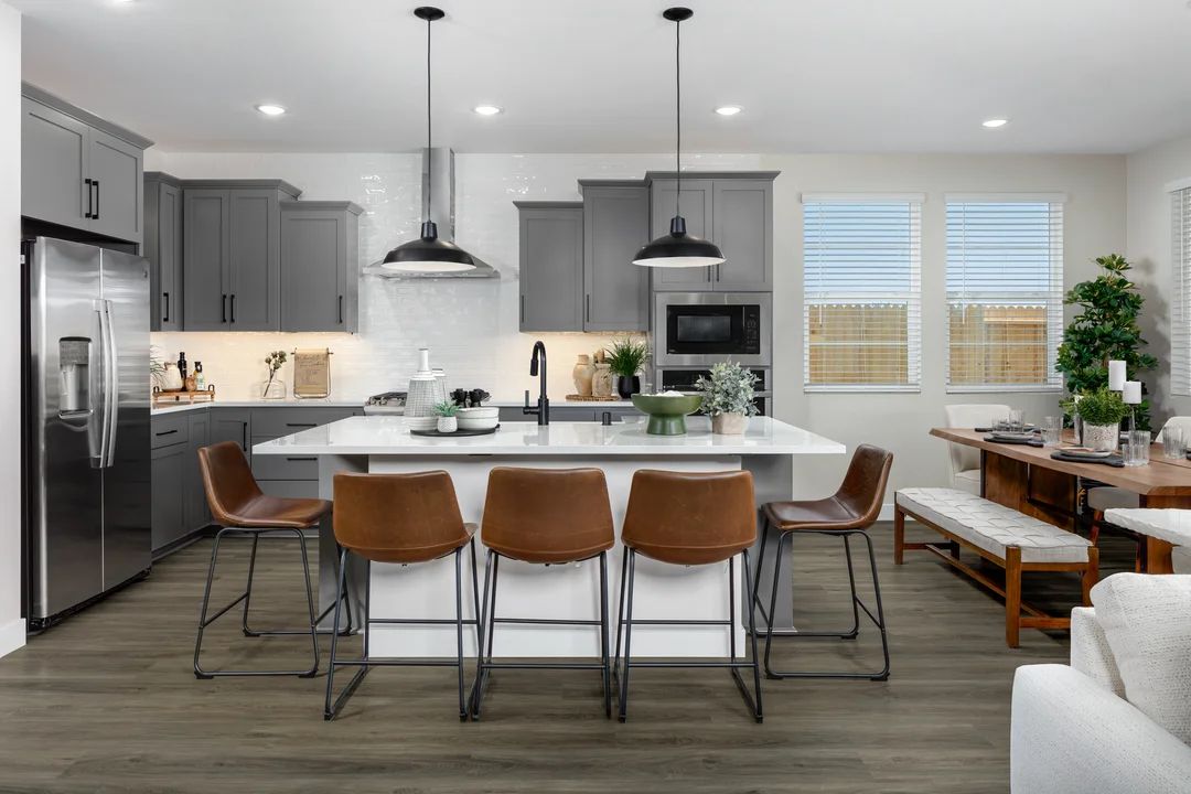 Kitchen with pendant lighting and quartz countertops