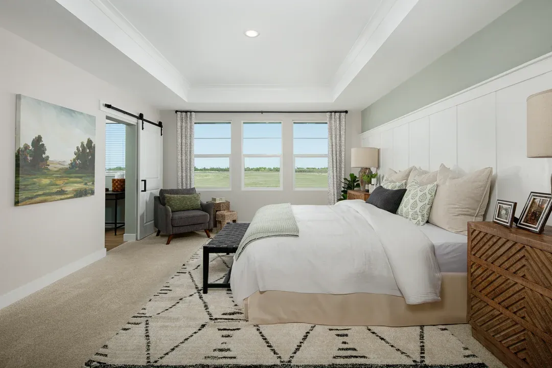 Primary suite with decorative feature wall