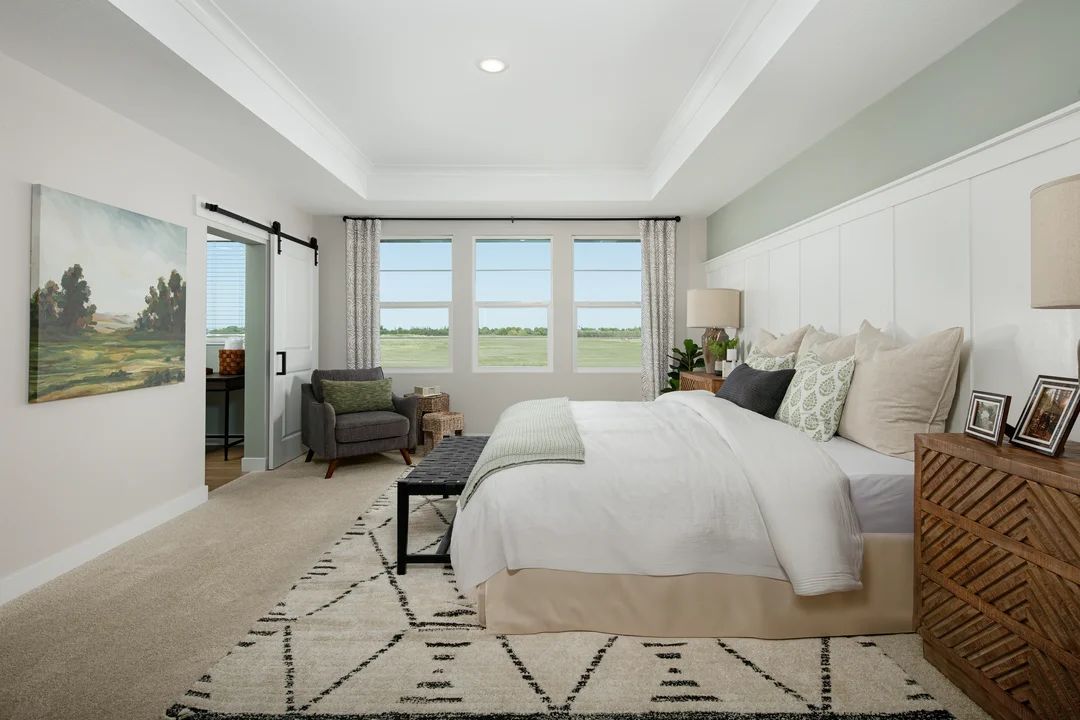 Primary suite with decorative feature wall