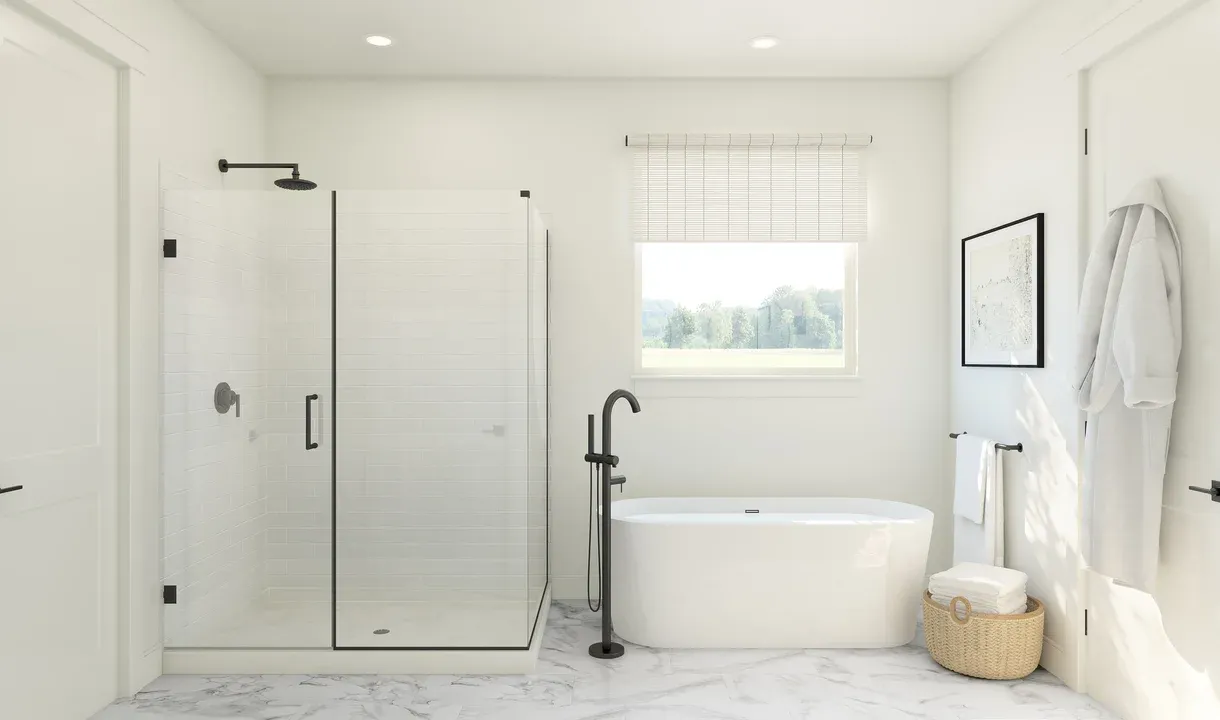 Primary bath with freestanding tub and glass shower enclosure