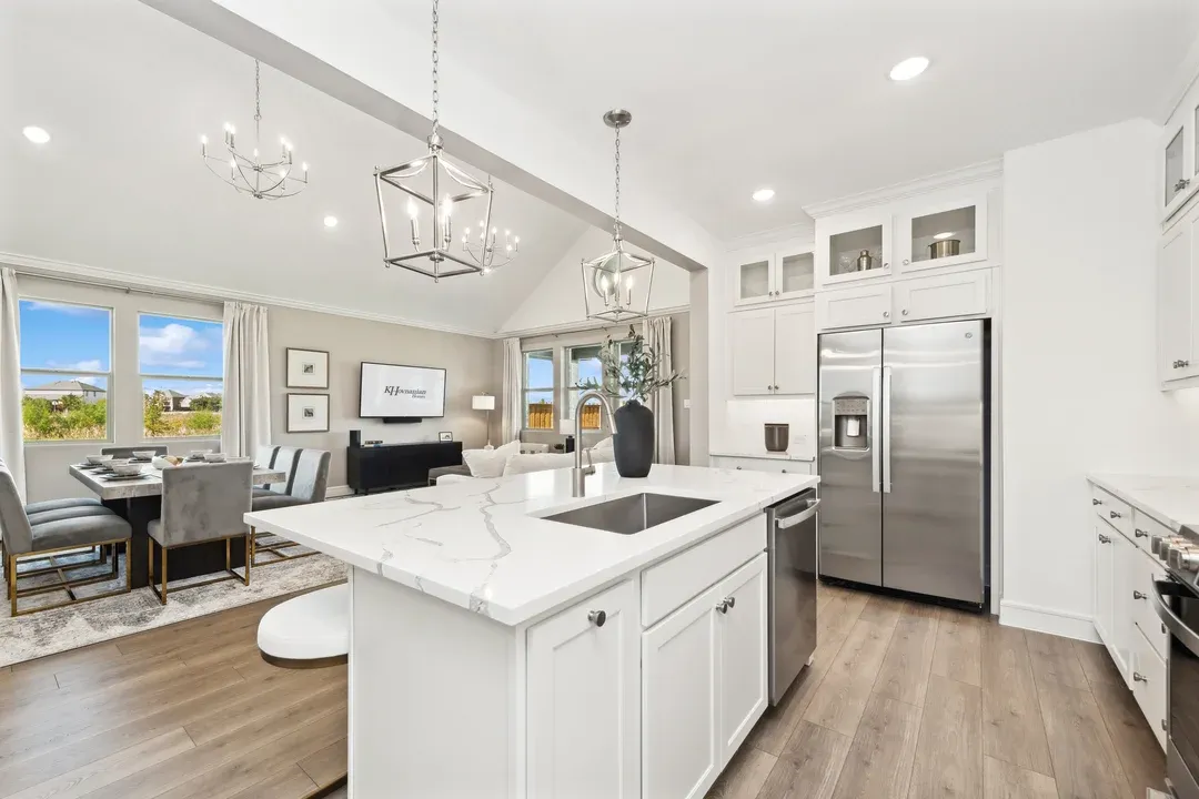 Kitchen with glass upper cabinets overlooking dining area