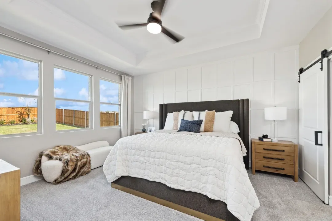 Primary suite with decorative feature wall