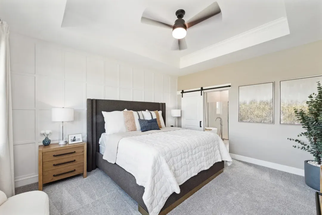 Primary suite with decorative feature wall