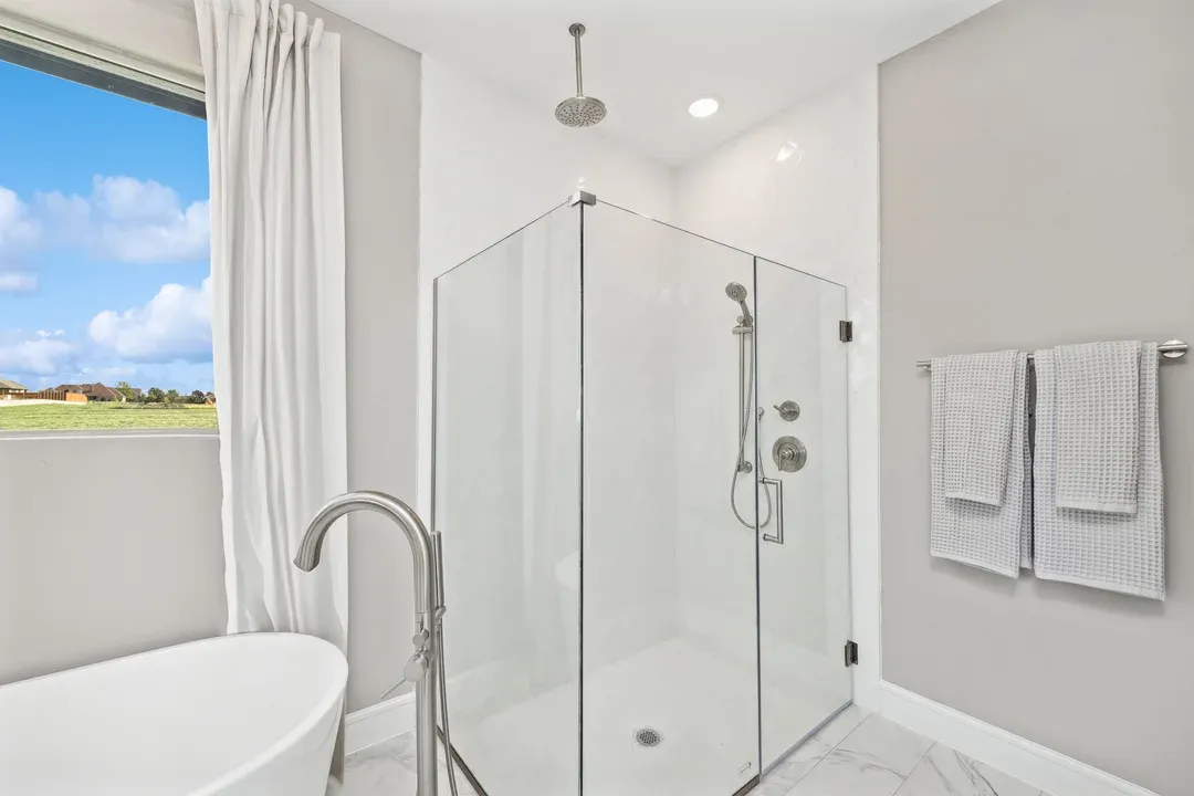 Primary bath with glass shower enclosure