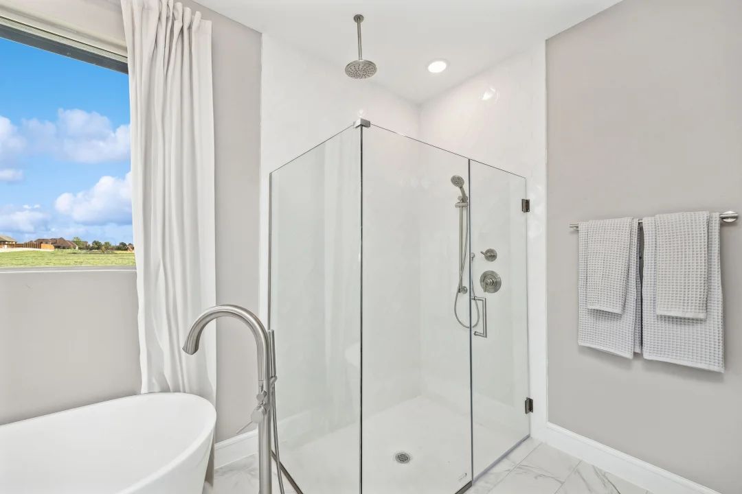 Primary bath with glass shower enclosure
