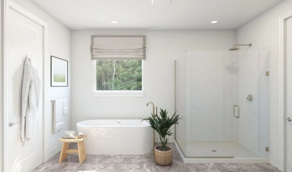 Primary bath with freestanding tub and glass shower enclosure