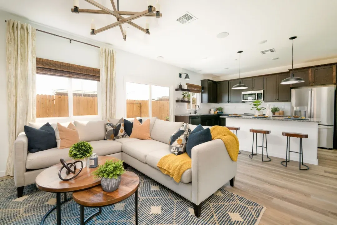 Great room with chandelier and wood flooring