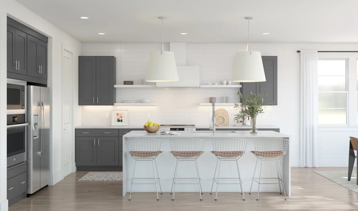Kitchen with pendant lighting and waterfall island