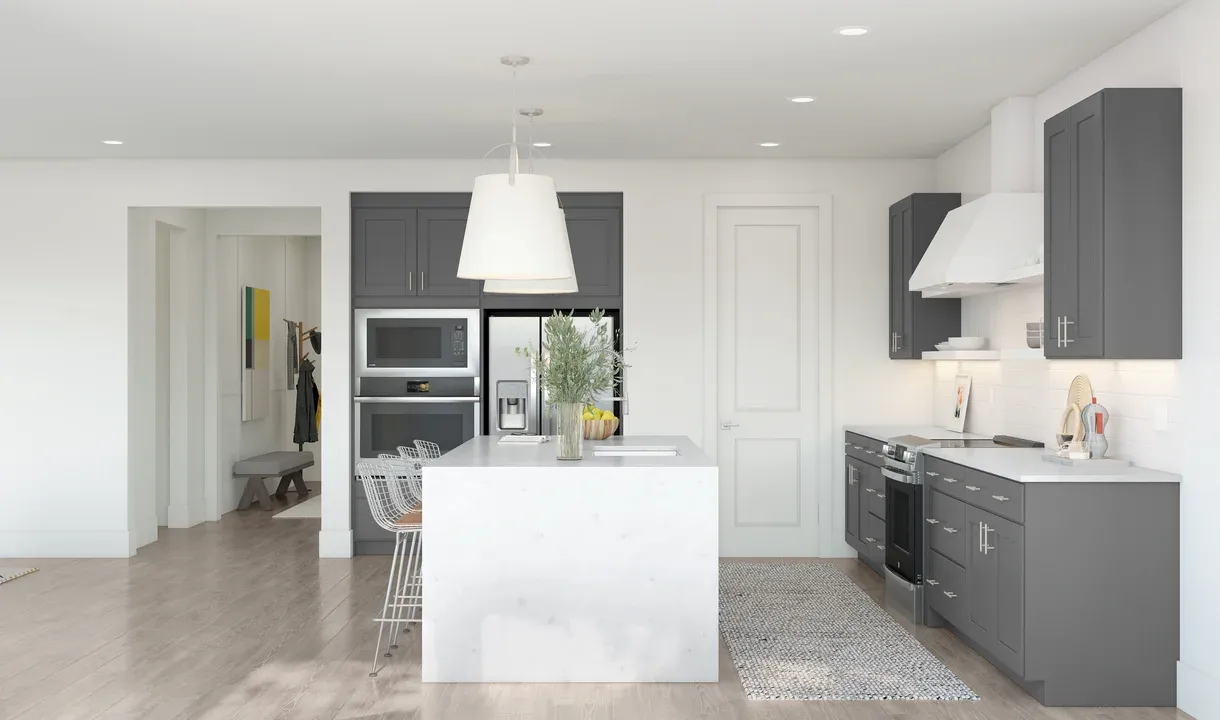 Kitchen with pendant lighting and waterfall island
