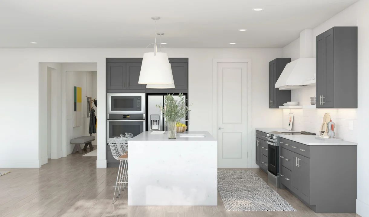 Kitchen with pendant lighting and waterfall island