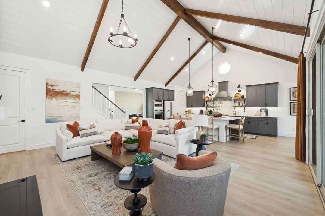 Great room with vaulted ceiling and stained ceiling beams