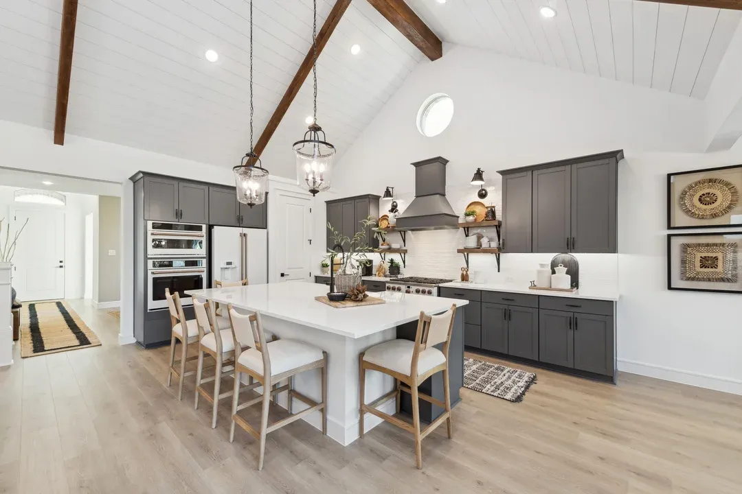 Kitchen with vaulted ceiling and pendant lighting