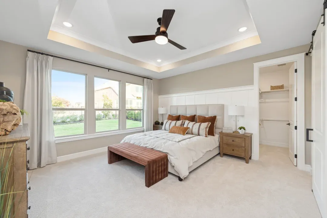 Primary suite with decorative feature walls